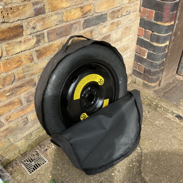 Volkswagen Tiguan spare wheel in black carry bag.