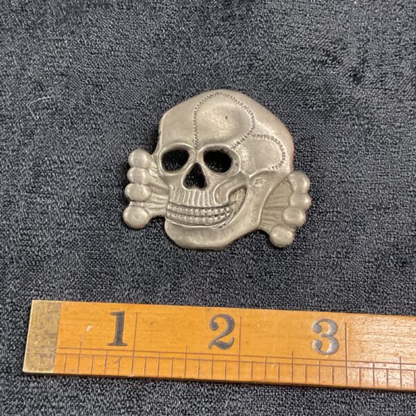 Front view of a Waffen SS Totenkopf skull badge.