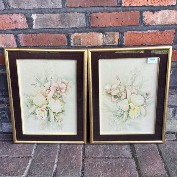 Vintage watercolour still life painting of delicate flowers.