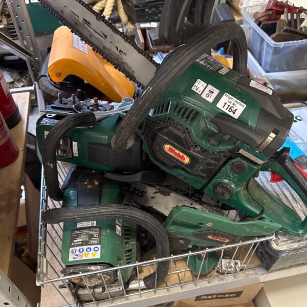 Webb chainsaw engine and parts lot for garden maintenance.