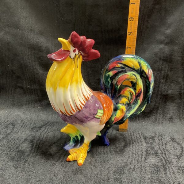 Vibrant Wedgewood handpainted Cockrell figurine in a side view.