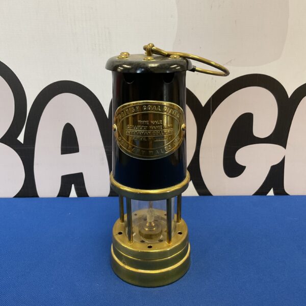 Antique brass Welsh miners lamp, a piece of British coal mining history.