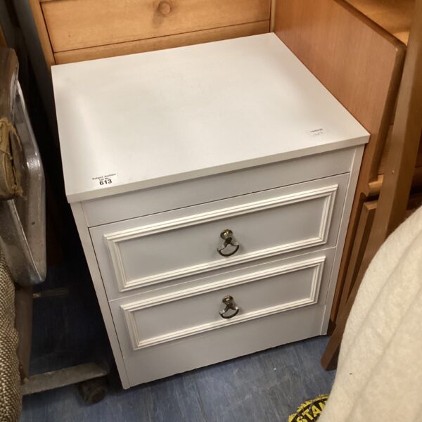 White two-drawer bedside cabinet for bedroom storage.