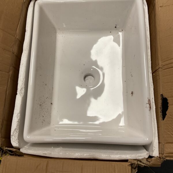 New white ceramic Belfast sink for kitchen or bathroom.