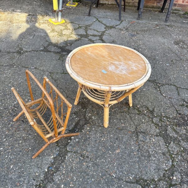 Vintage wicker table with integrated magazine rack for storage.