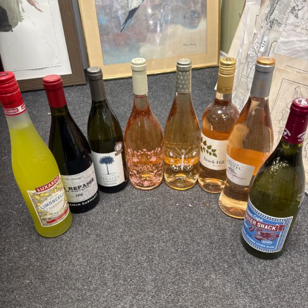Assorted wine and limoncello bottles in a collection.