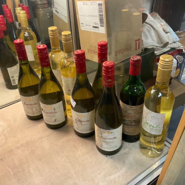 Wine lot featuring Lapostolle and 1969 Chateau La Cour bottles.