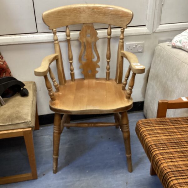 Vintage wooden carver dining chair with decorative spindles.
