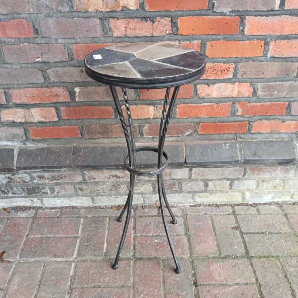 Vintage wrought iron garden table with slate top.