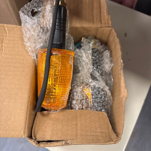 Yamaha 125cc motorcycle indicators in original packaging.
