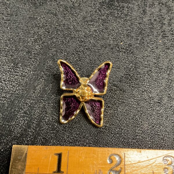 Yves Saint Laurent butterfly brooch with purple enamel wings.