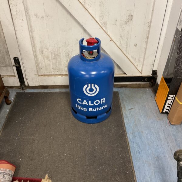 Blue 15kg Calor Butane gas cylinder for outdoor use.
