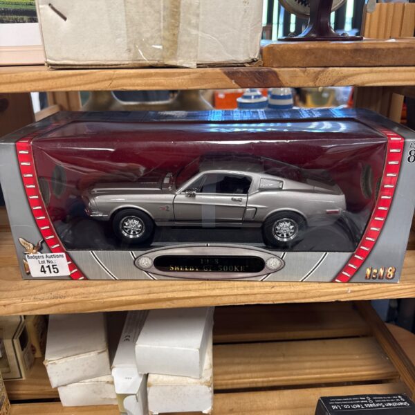 Detailed 1:18 scale diecast model of the 1968 Shelby GT500KR muscle car.