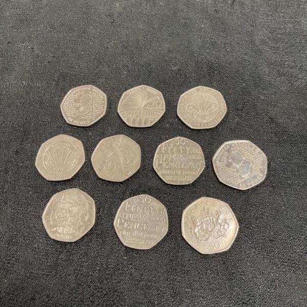 Lot of ten commemorative 50p coins, including Sherlock Holmes and Roger Bannister.