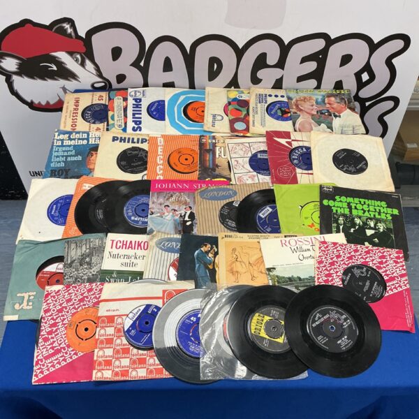 Vintage 7” vinyl record collection including Beatles singles.