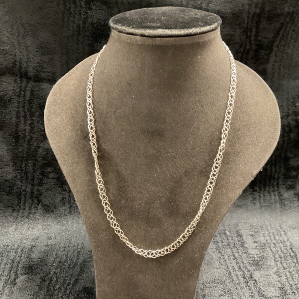 Delicate 925 silver double link necklace on a display stand.