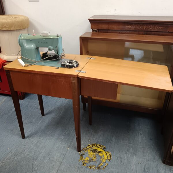 Vintage Singer sewing machine table with electric sewing machine