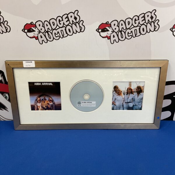 Framed Abba Arrival album cover and CD display.