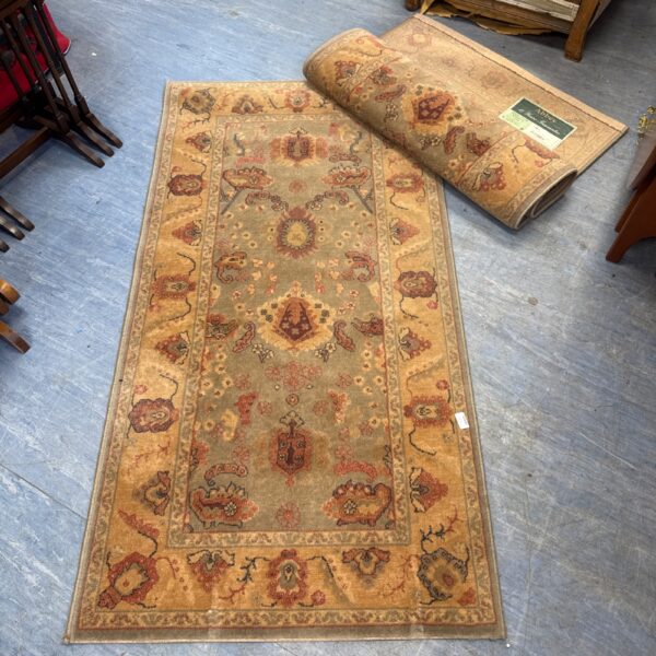 Overhead view of a pair of vintage Abbey Ismir Turkish rugs.
