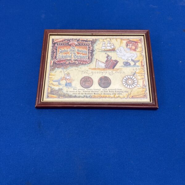 Framed display of antique coins from the Admiral Gardner shipwreck.