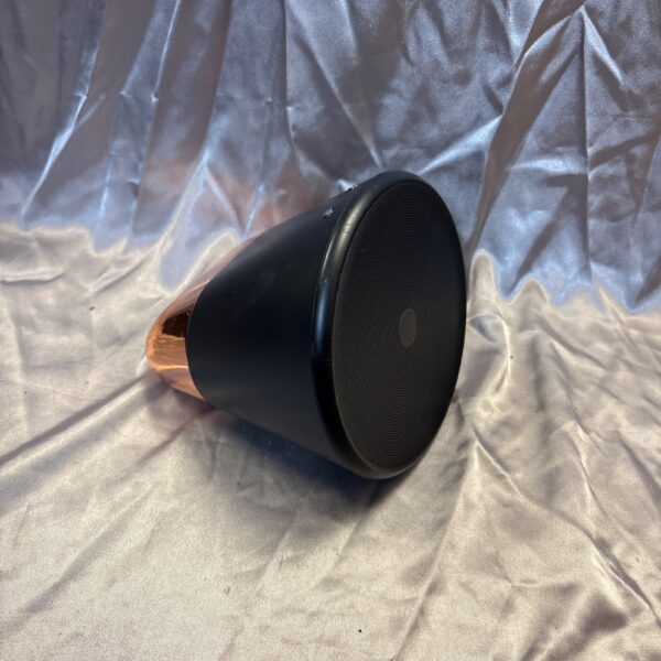Sleek black Aether Cone Bluetooth speaker on a patterned surface.