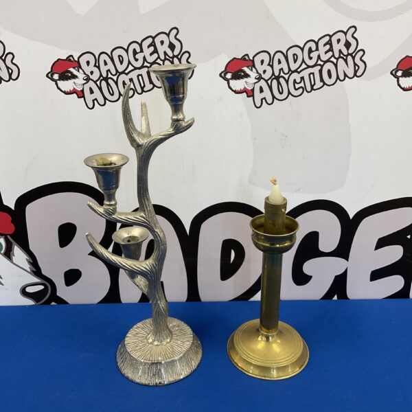 Ornate aluminium antler candlestick with brass accents.