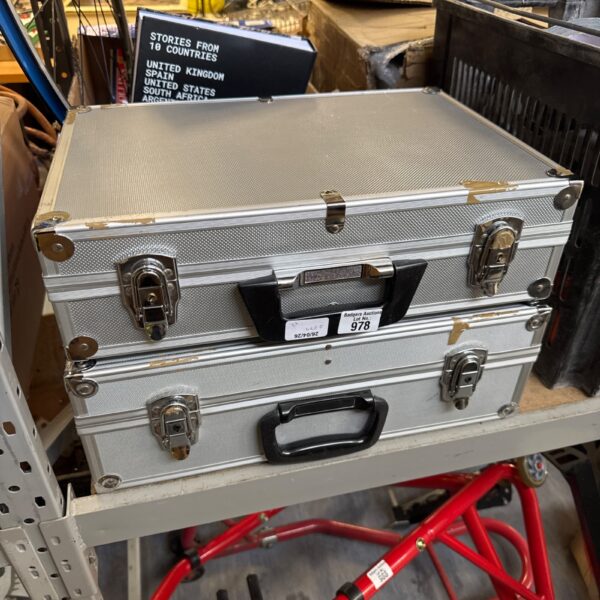 Pair of aluminium flight cases for equipment protection.