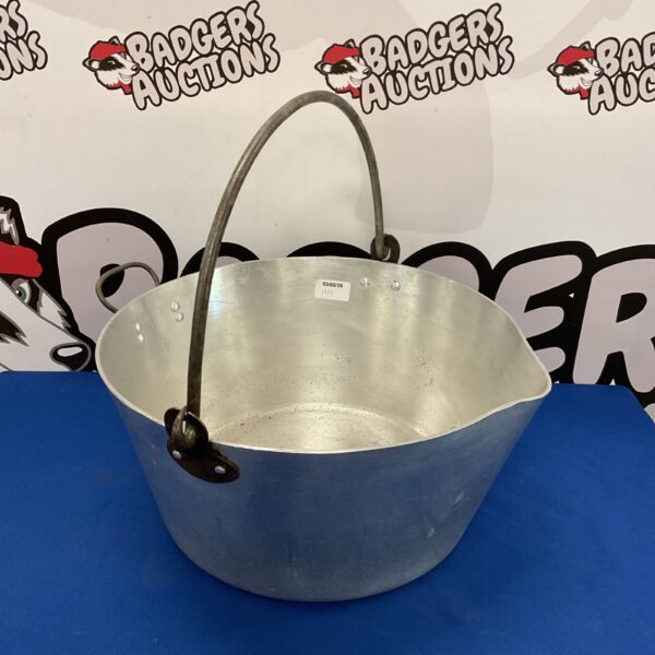 Large aluminium jam pan with iron handle for cooking preserves.