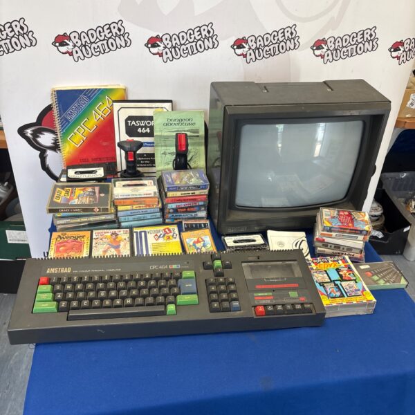 Vintage Amstrad CPC 464 computer with monitor and games.