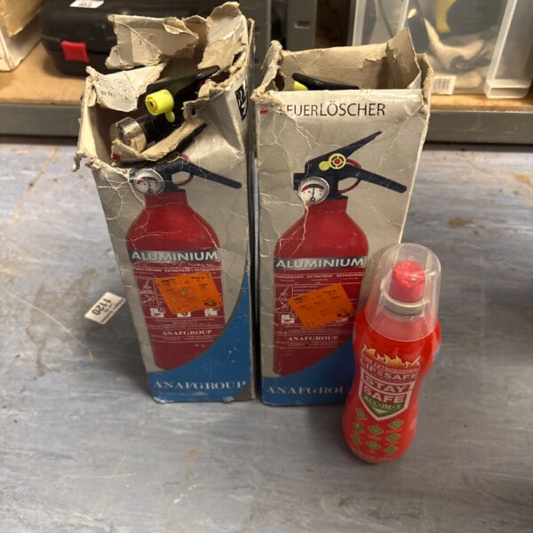 Vintage Anafgroup fire extinguishers in damaged packaging.
