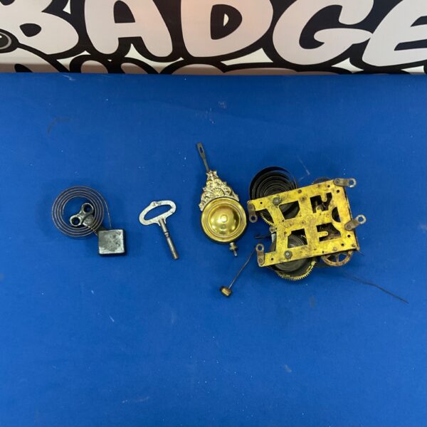 Antique Ansonia New Haven clock movement with brass gears.