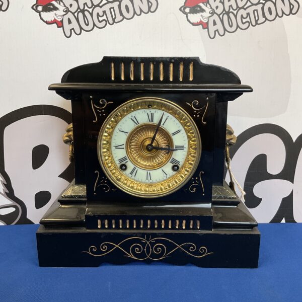 Antique Allison New York steel mantle clock with porcelain dial.