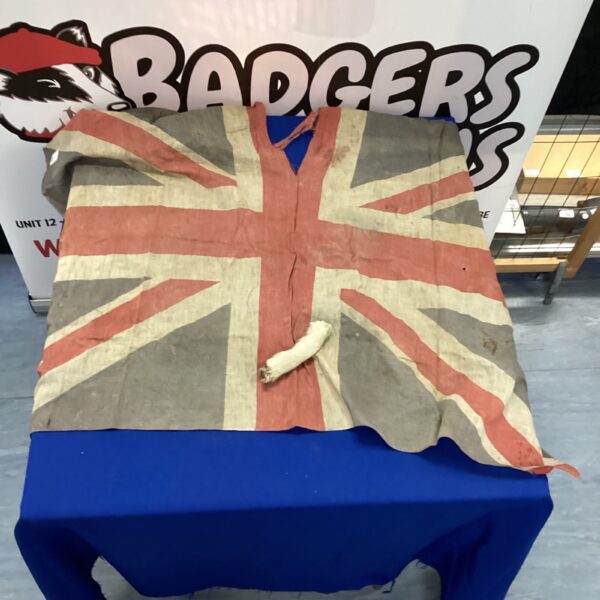 Antique British flag with a dog foot motif, vintage textile.