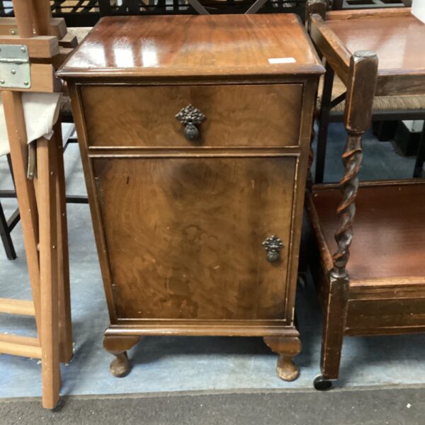 Antique burr walnut bedside cabinet with a single drawer.