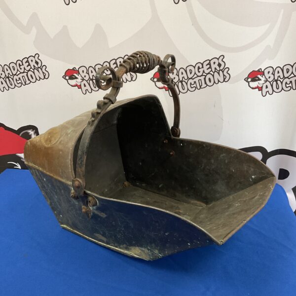 Antique copper coal scuttle with wrought iron handle and supports.