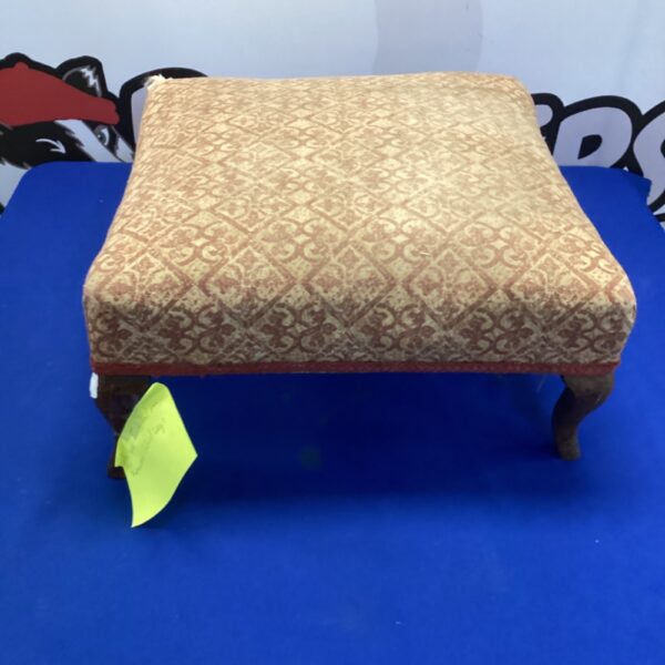Antique footstool with carved rosewood cabriole legs and upholstered seat.