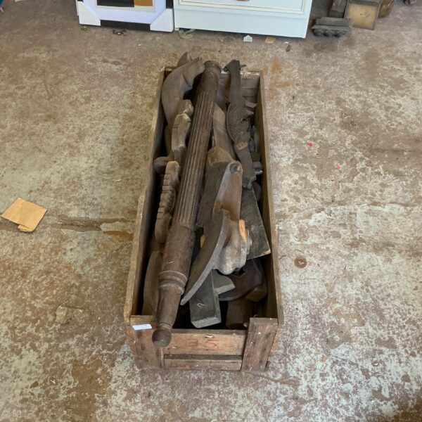 Crate of antique furniture parts and salvage wood.