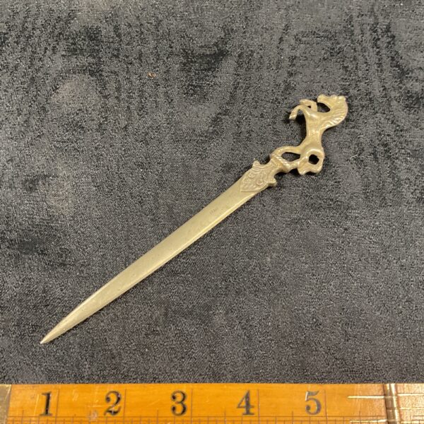 Antique horse letter opener with detailed prancing horse head.