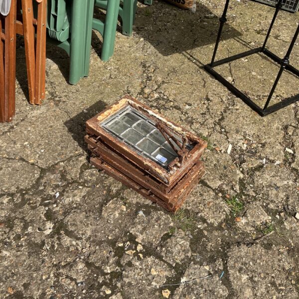 Lot of six antique leaded windows with intricate metalwork.