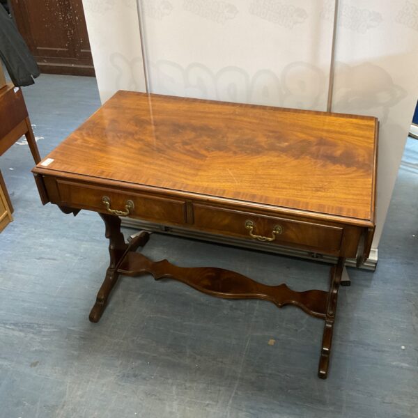 Antique mahogany sofa table with two drawers and slender legs.