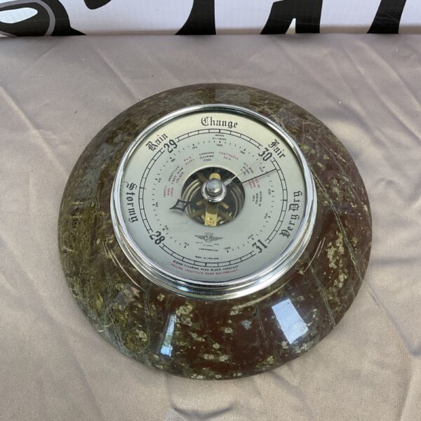 Antique marble barometer with brass dial and thermometer.