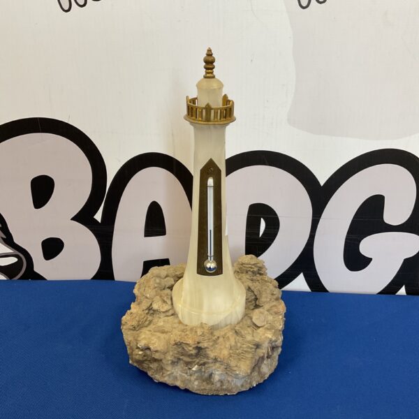 Antique mercury lighthouse thermometer with faux marble base.
