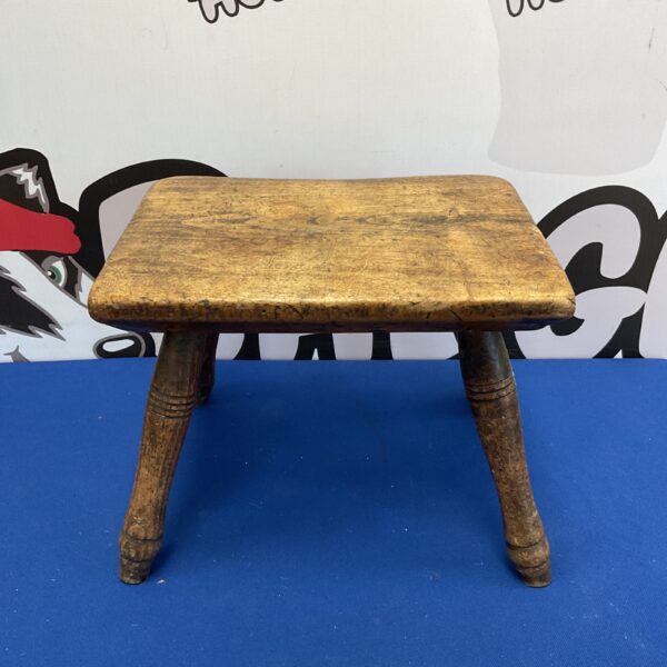 Antique oak footstool with turned legs, a charming Victorian piece.