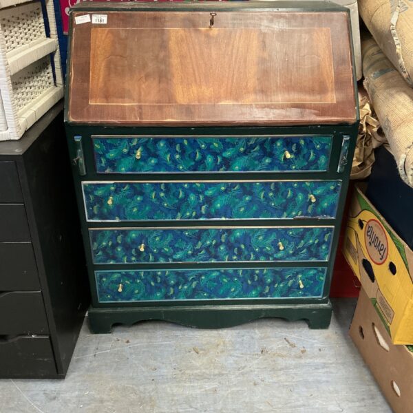 Antique painted writing desk with decorative design.