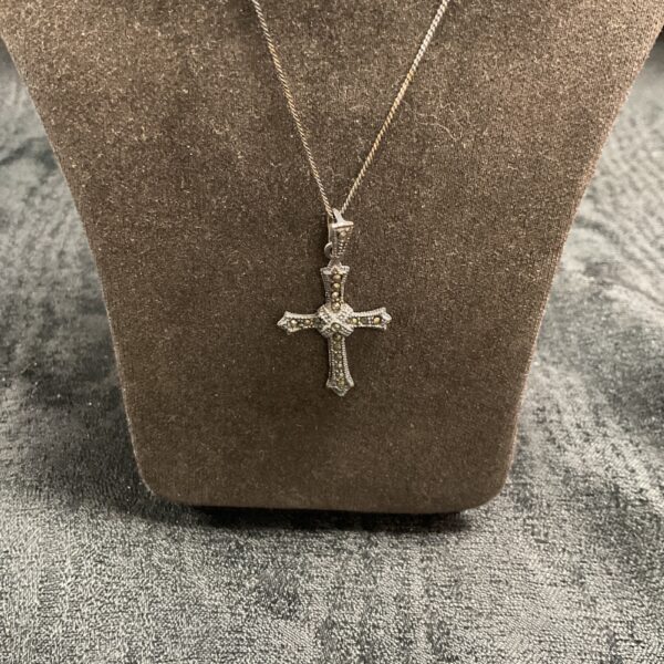 Antique Italian silver crucifix pendant on a delicate chain.