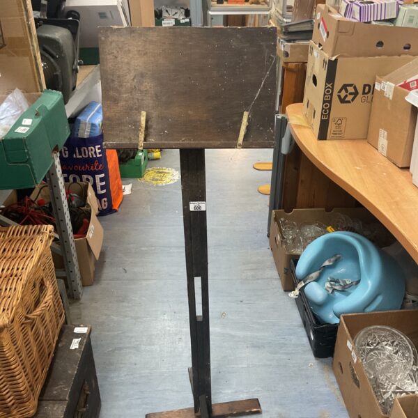 Antique wooden lectern with a slanted reading surface.