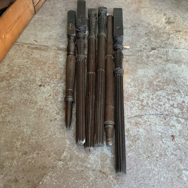 Antique wooden spindle legs from Victorian furniture, detailed turning.