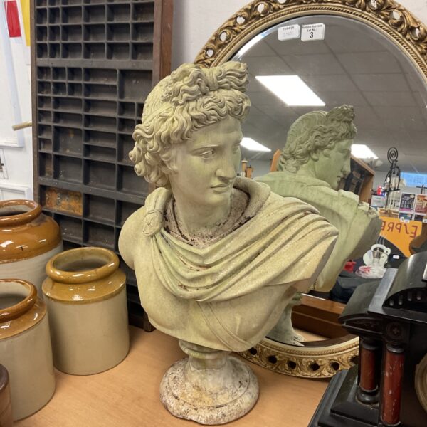 Cast stone Apollo Belvedere bust, classical garden sculpture.