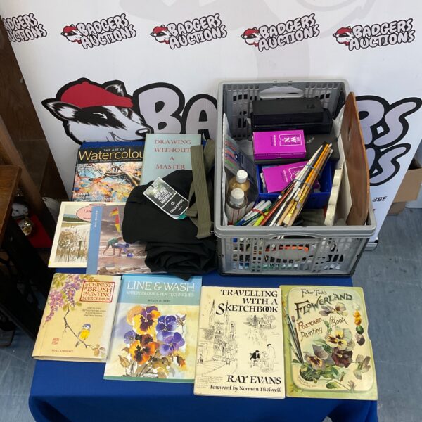 Mixed lot of art books and watercolour painting brushes.