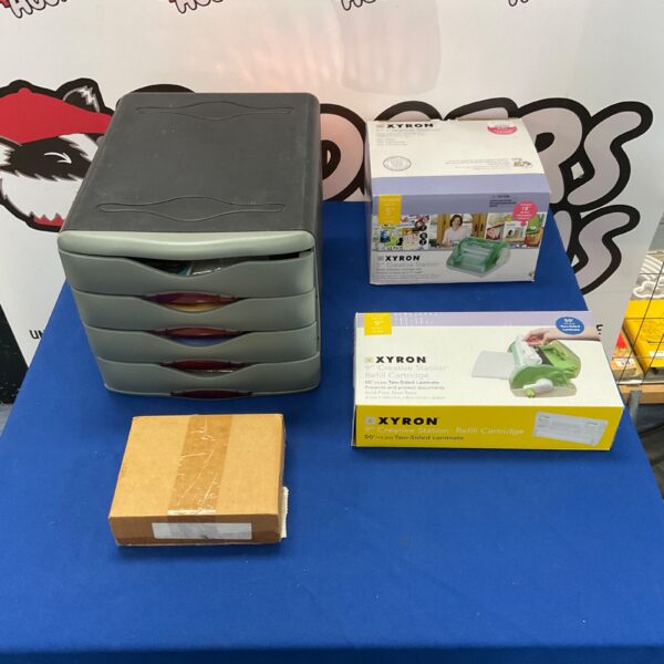 Arts and crafts storage with Xyron 5” Creative Station and refill cartridge.